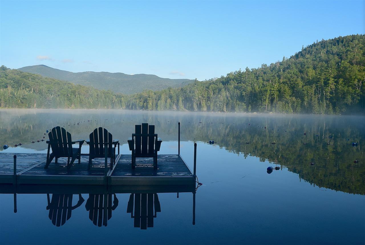 Lake with Adirondack chairs